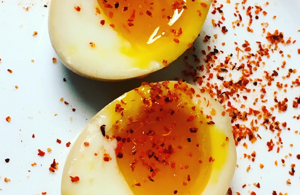 Boiled egg cut open to show the cooked yolk