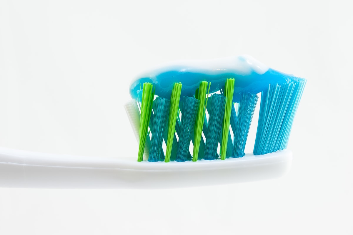 A toothbrush with toothpaste on a bristle head